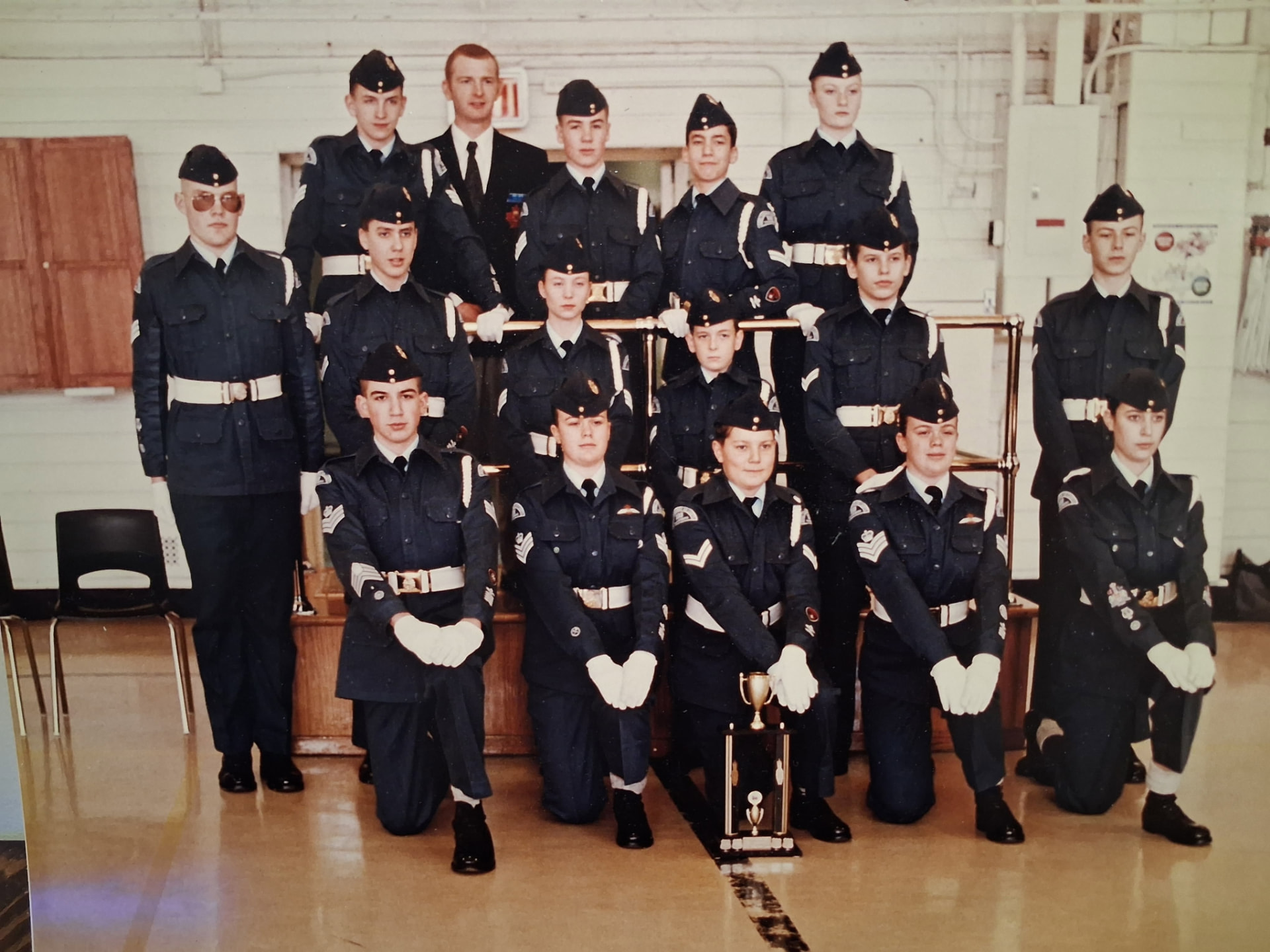 Bradley Weston with the 103 Thunderbird Squadron drill team and its provincial first-place trophy in 1994.