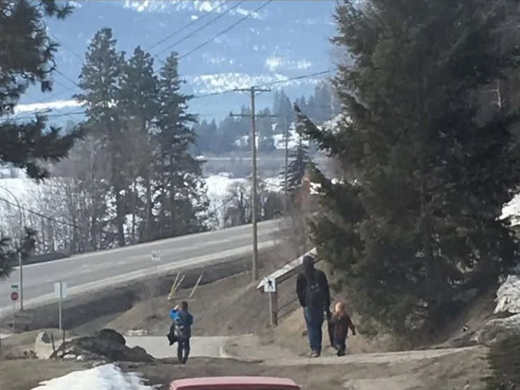 Bradley Weston and his sons collecting litter during a walk through Lumby in March 2018.