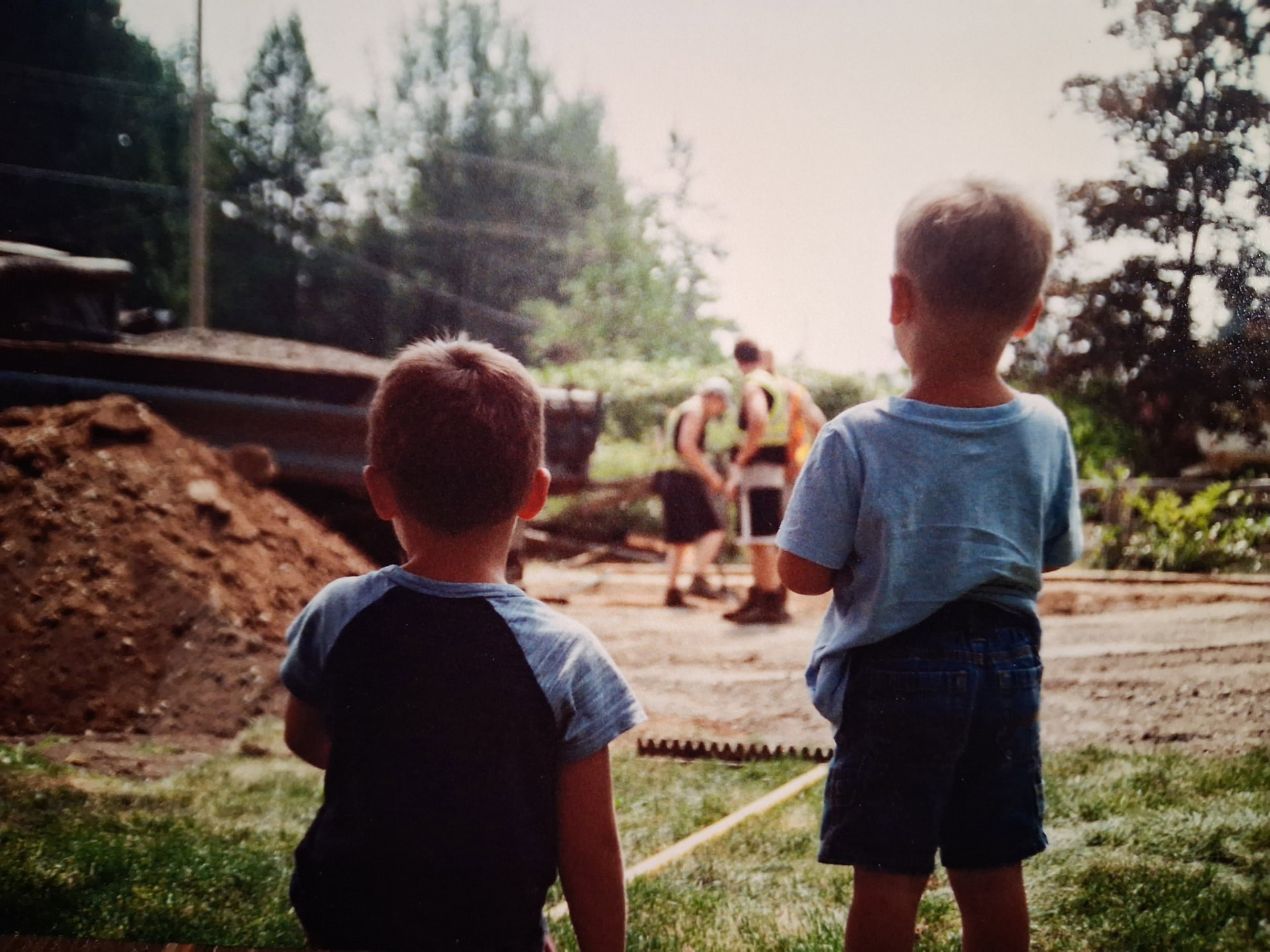 Bradley Weston’s sons watching him consult with his former paving company in May 2018.